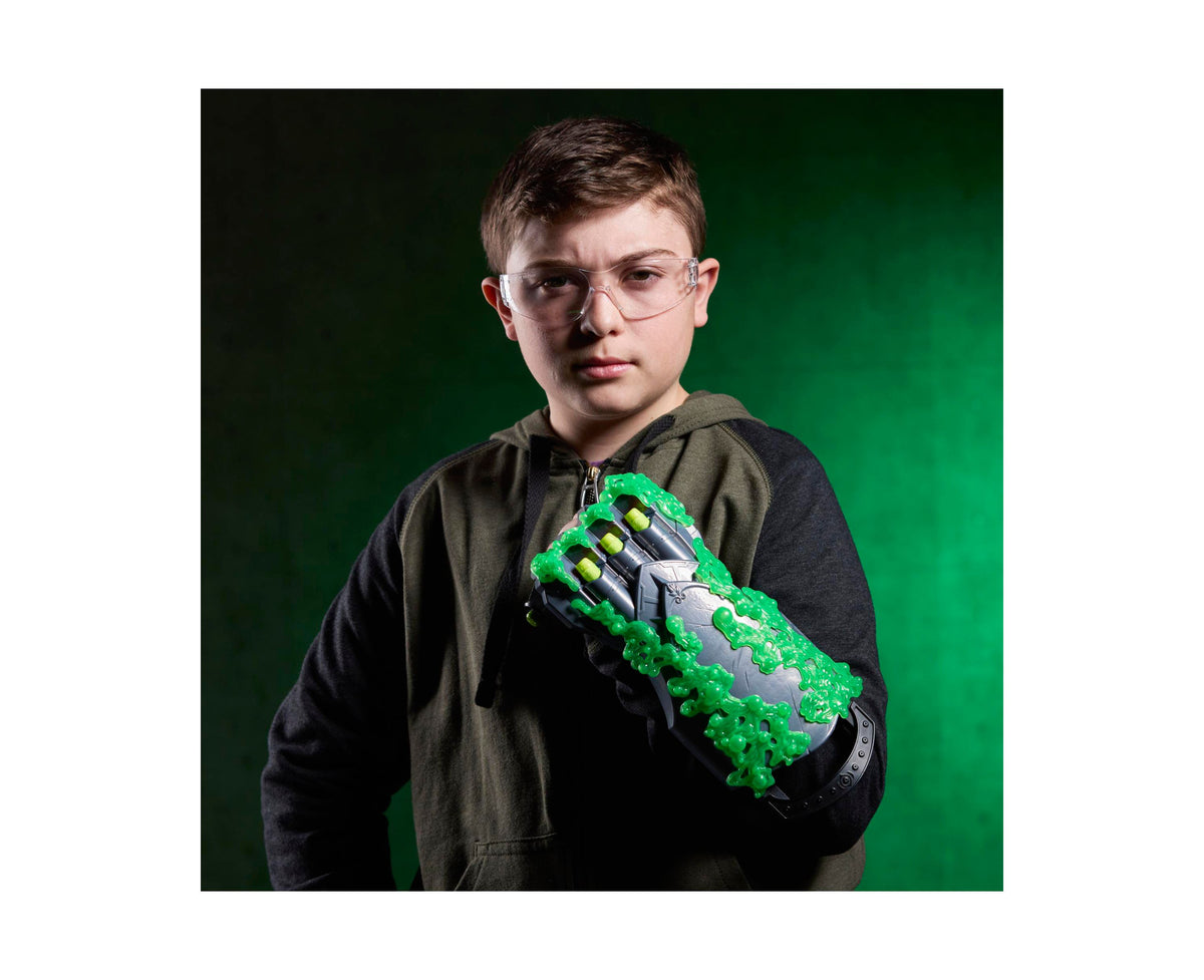 Marvel Doctor Doom Doomglow NERF Triad blaster with green glow-in-the-dark gauntlet design held by child