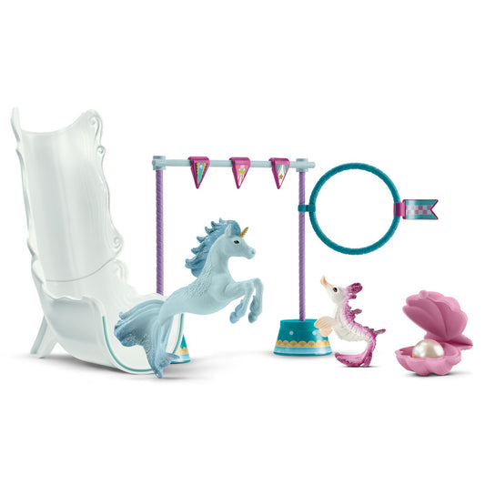 Schleich Bayala Magical Underwater Tournament playset with light blue unicorn, white and purple sea dragon figure, white throne chair, teal exercise ring with b