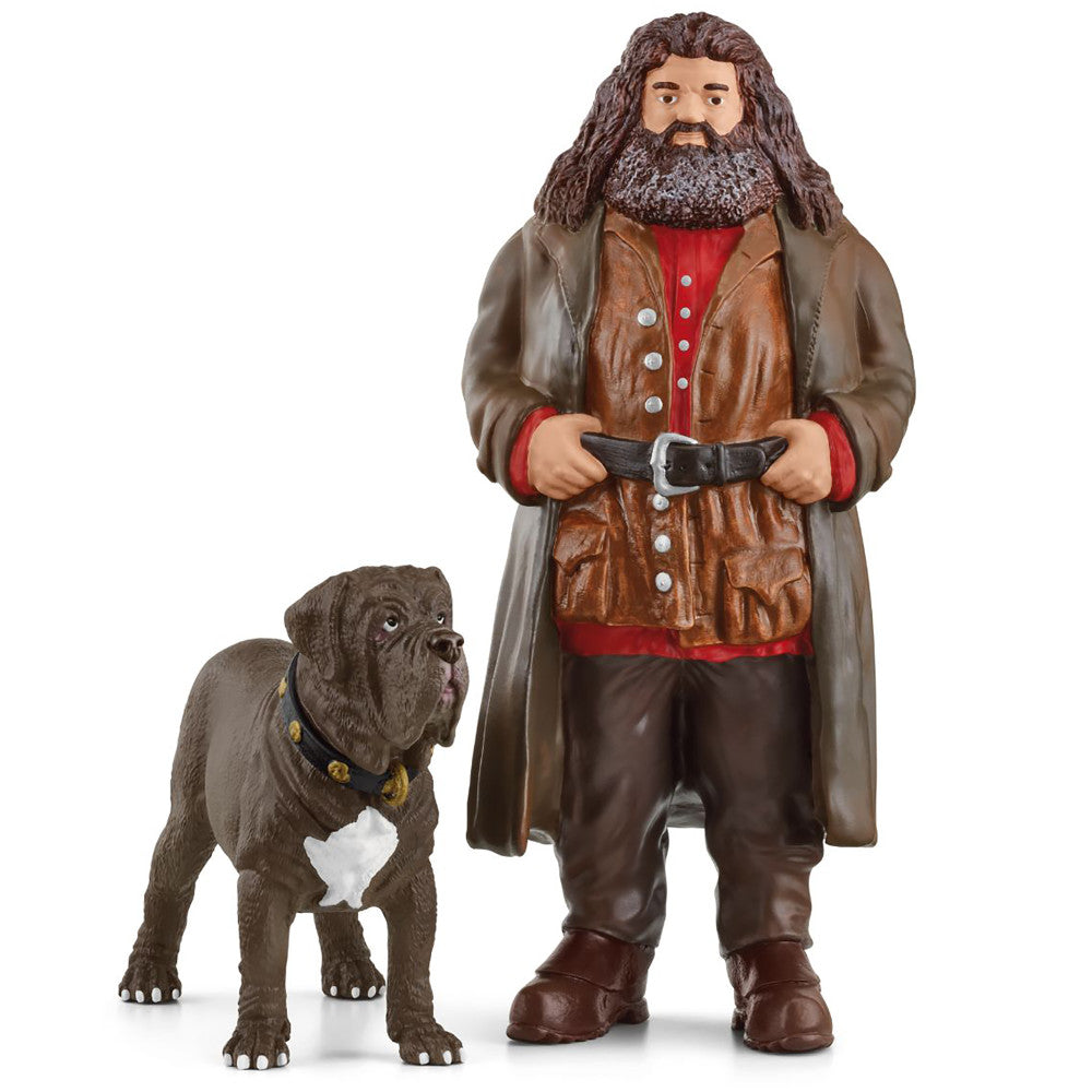 Hagrid action figure with long brown hair and beard wearing brown leather vest and coat with red shirt, holding black belt, standing next to Fang the dog figure