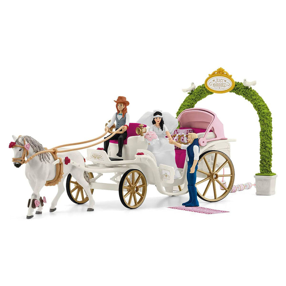 Wedding carriage playset with white horse, two character figures, bride doll, decorated arch, and pink carriage with gold wheels