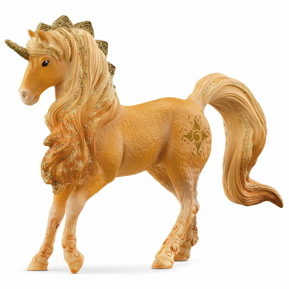 Golden-brown unicorn stallion figurine with flowing mane and tail trimmed in gold glitter, ornate decorative hooves, and sun symbol on flank