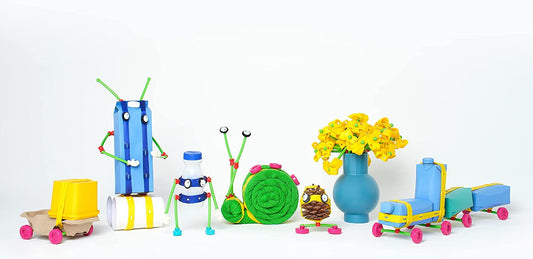 Toyi Creative Play Master Set with colorful building pieces including yellow dump truck, blue rocket, green caterpillar, snail, flower vase, owl figure, and whe