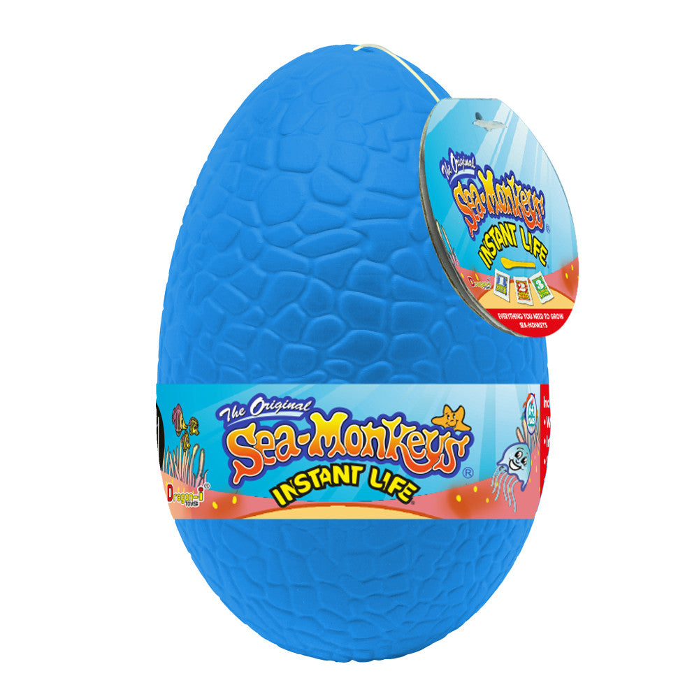 Blue egg-shaped Sea-Monkey Instant Life container with textured surface and colorful product label attached