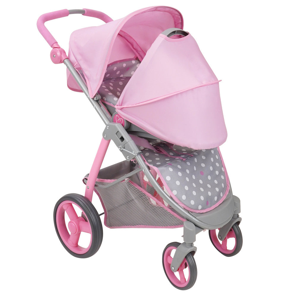 Pink and grey doll stroller with polka dot pattern, push handle, canopy hood, and storage basket on three wheels