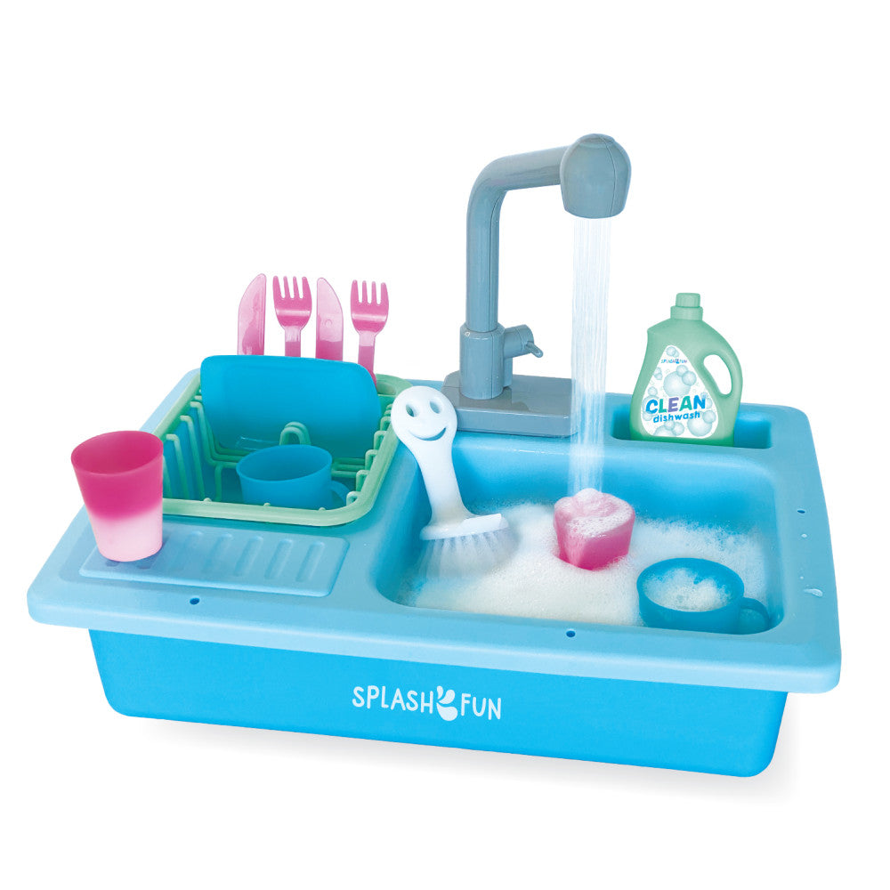 Blue toy kitchen sink with running water feature, pink dishes, forks, brush, sponge, and green dishwash bottle