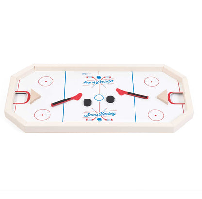 Smashockey tabletop game with white playing surface, red and blue markings, two red mallets with black handles, and three pucks in center