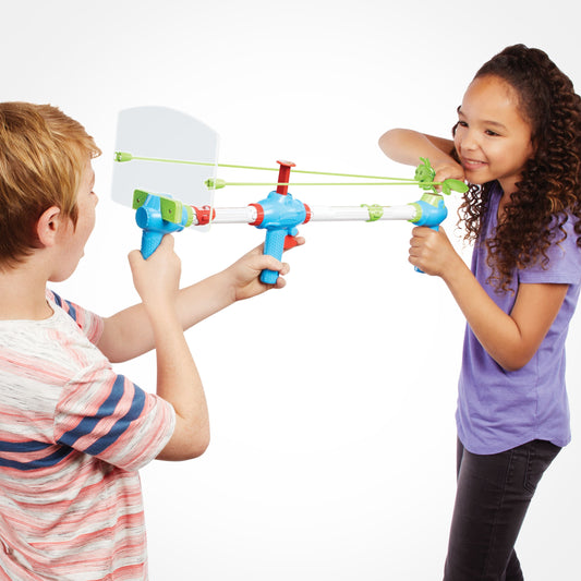 Two children modeled with blue slingshot toys connected by green elastic cords, playing slingshot duel game