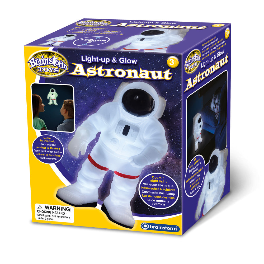 Brainstorm Toys Light-up & Glow Astronaut, white plush figure with purple gloves and red belt on starry purple packaging