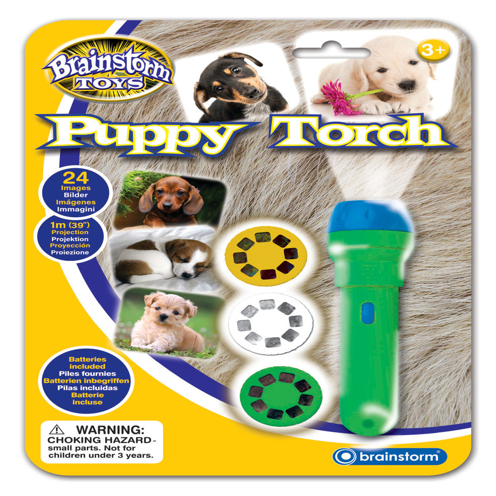 Brainstorm Toys Puppy Torch packaging showing green flashlight with blue top, three interchangeable slide discs featuring puppy images, and photos of different
