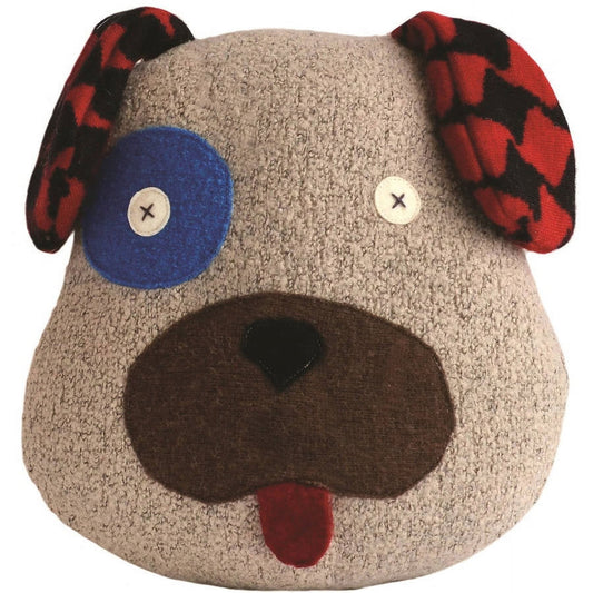Plush dog pillow with beige textured body, red and black plaid ears, mismatched eyes (one blue, one white), brown snout, and red tongue sticking out