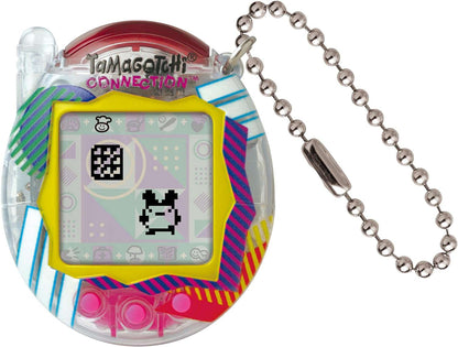 Tamagotchi Connection Clear Retro virtual pet game with yellow frame, colorful striped shell, LCD screen displaying pixel character, and silver ball chain keych