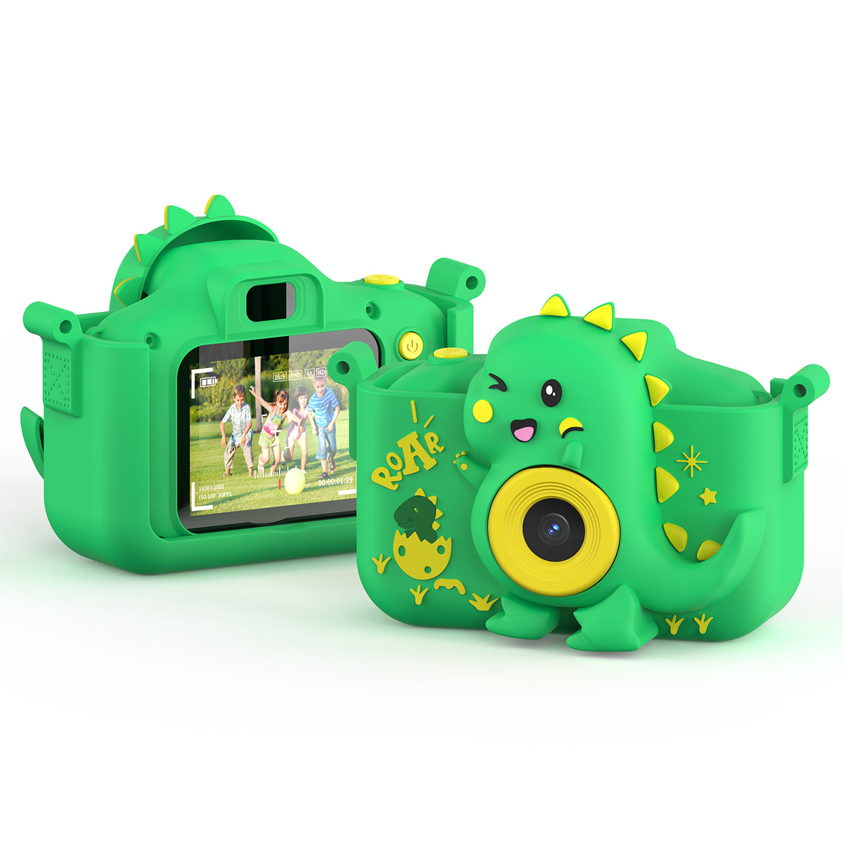 Green dinosaur-shaped kids' digital camera with yellow accents, featuring a yellow lens on front and display screen showing video of children playing outdoors o