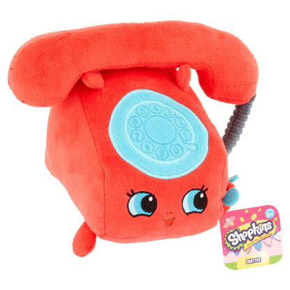 Red plush Shopkins Chatter character with light blue dial face, large eyes, and gray cord receiver