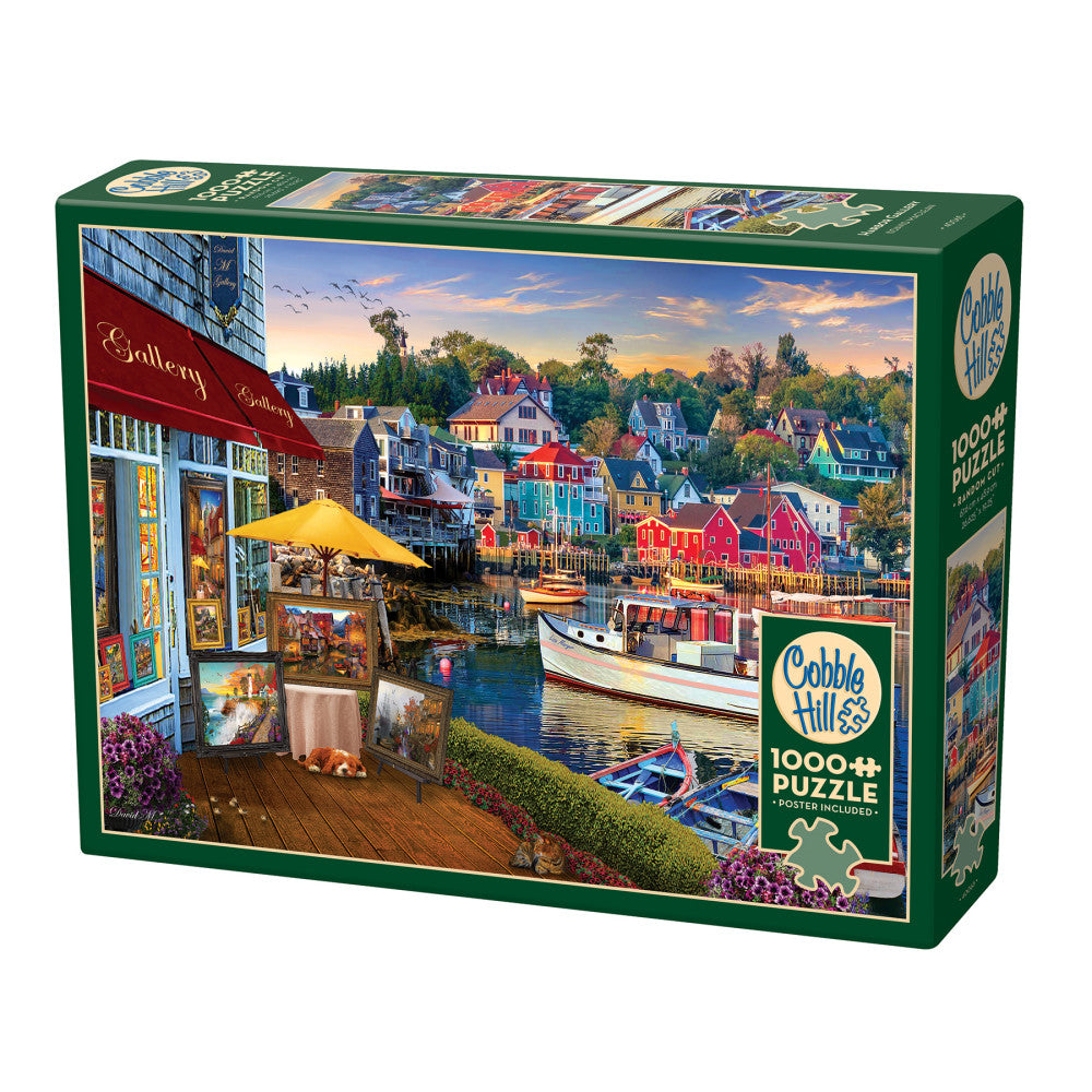 Cobble Hill 1000-piece puzzle box featuring a waterfront gallery scene with colorful harbor houses, boats, and a yellow umbrella café overlooking the water