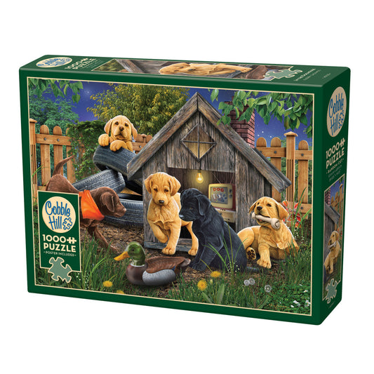 Cobble Hill 1000 piece jigsaw puzzle box featuring three Labrador Retrievers playing outside a wooden doghouse at night