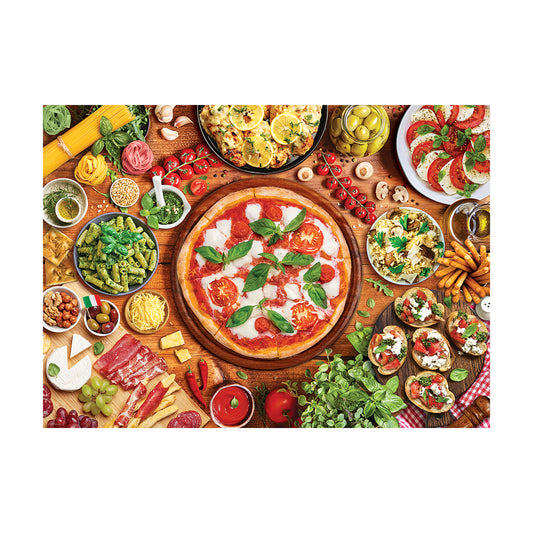 Overhead view of Italian food spread on wooden table with pizza, pasta, tomatoes, basil, cheese, cured meats, and fresh vegetables
