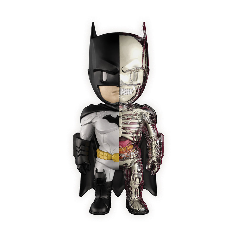 4D XXRAY Batman action figure with split anatomy view showing costume on left side and skeletal/internal structure on right side, 9.5 inches tall
