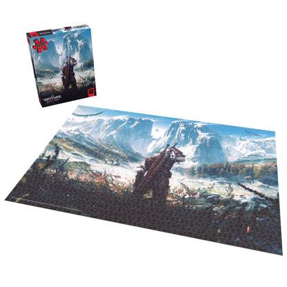The Witcher Skellige 1000-piece jigsaw puzzle shown assembled and in its blue box, featuring a warrior overlooking a snowy mountain landscape with castle ruins