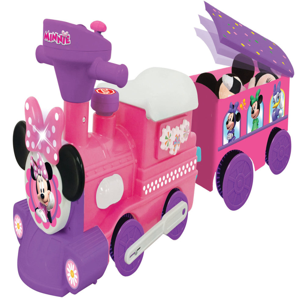 Pink and purple motorized ride-on train with Minnie Mouse graphics, featuring a locomotive engine with chimney, passenger car with opening roof, and purple whee