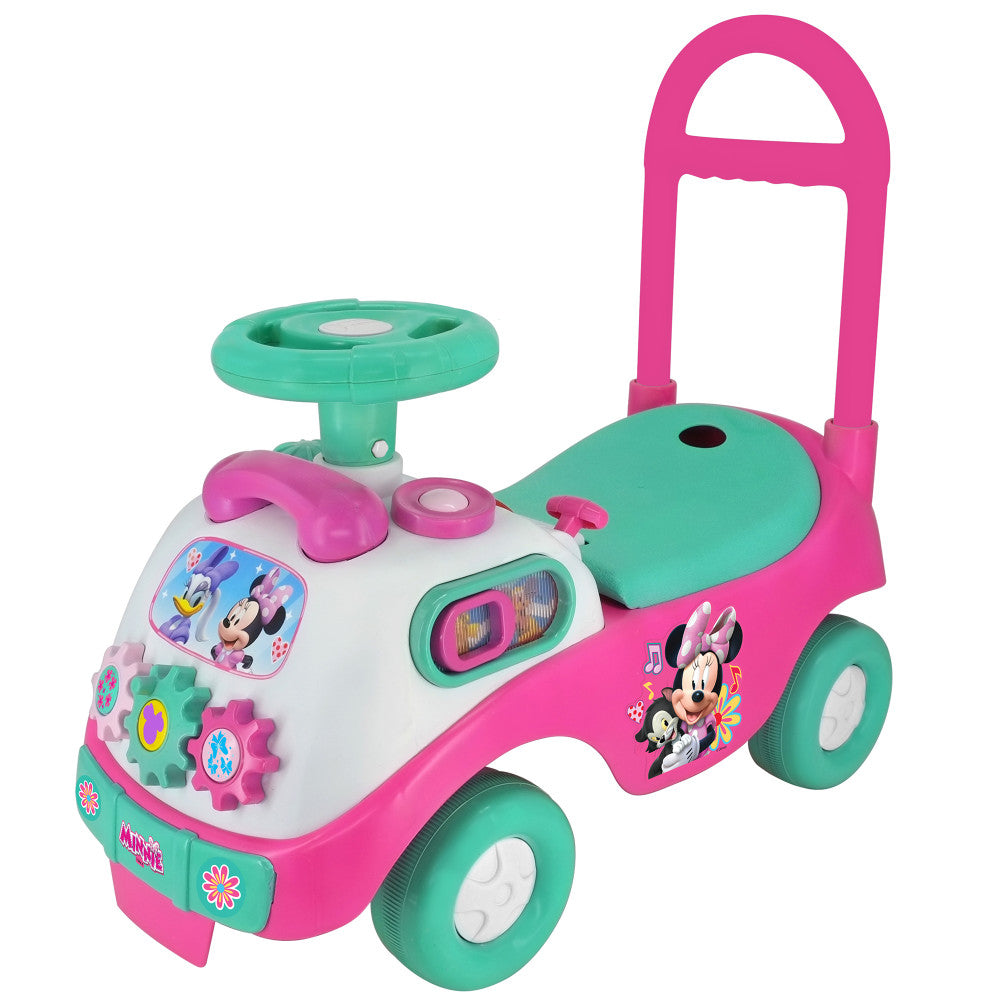 Minnie Mouse pink and teal foot-to-floor ride-on with steering wheel, interactive gears, and parent push handle