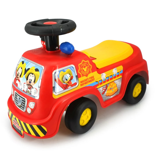 Red Mickey Mouse fire truck ride-on with black steering wheel, yellow seat and wheels, character graphics on sides, and blue ball detail