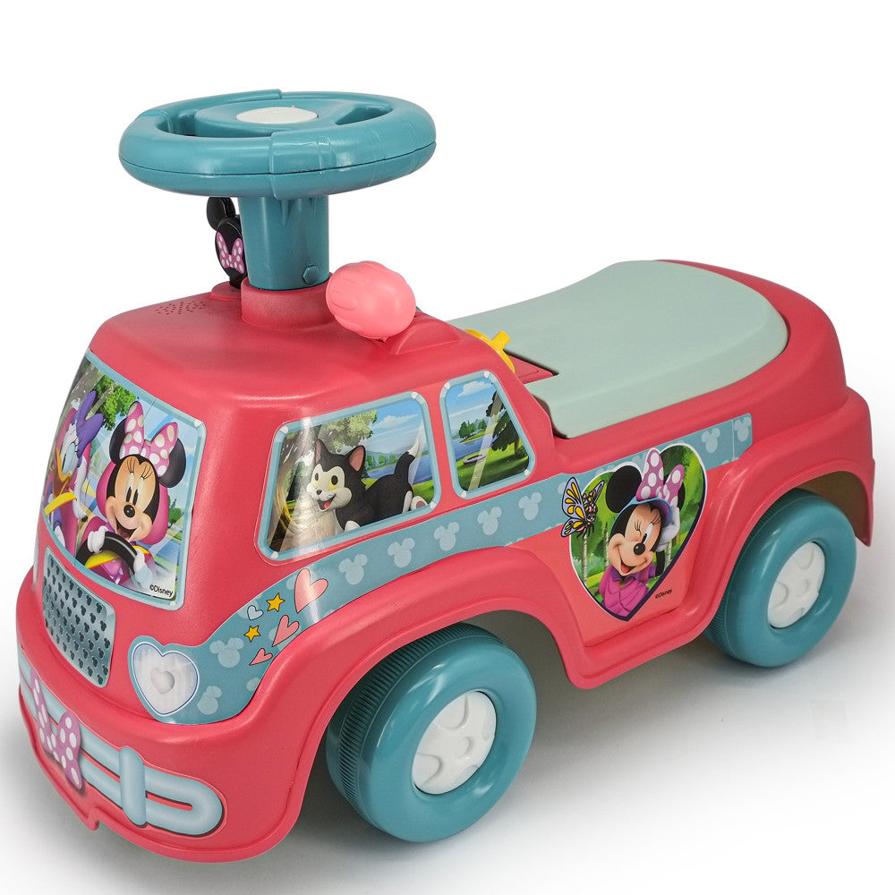 Red and teal ride-on camper vehicle with Minnie Mouse graphics, steering wheel, seat, and white wheels