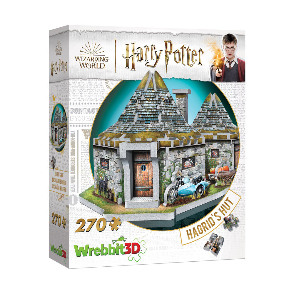 Wrebbit 3D puzzle box featuring Hagrid's Hut from Harry Potter, showing assembled stone cottage with peaked roofs, wooden door, and blue motorcycle with sidecar