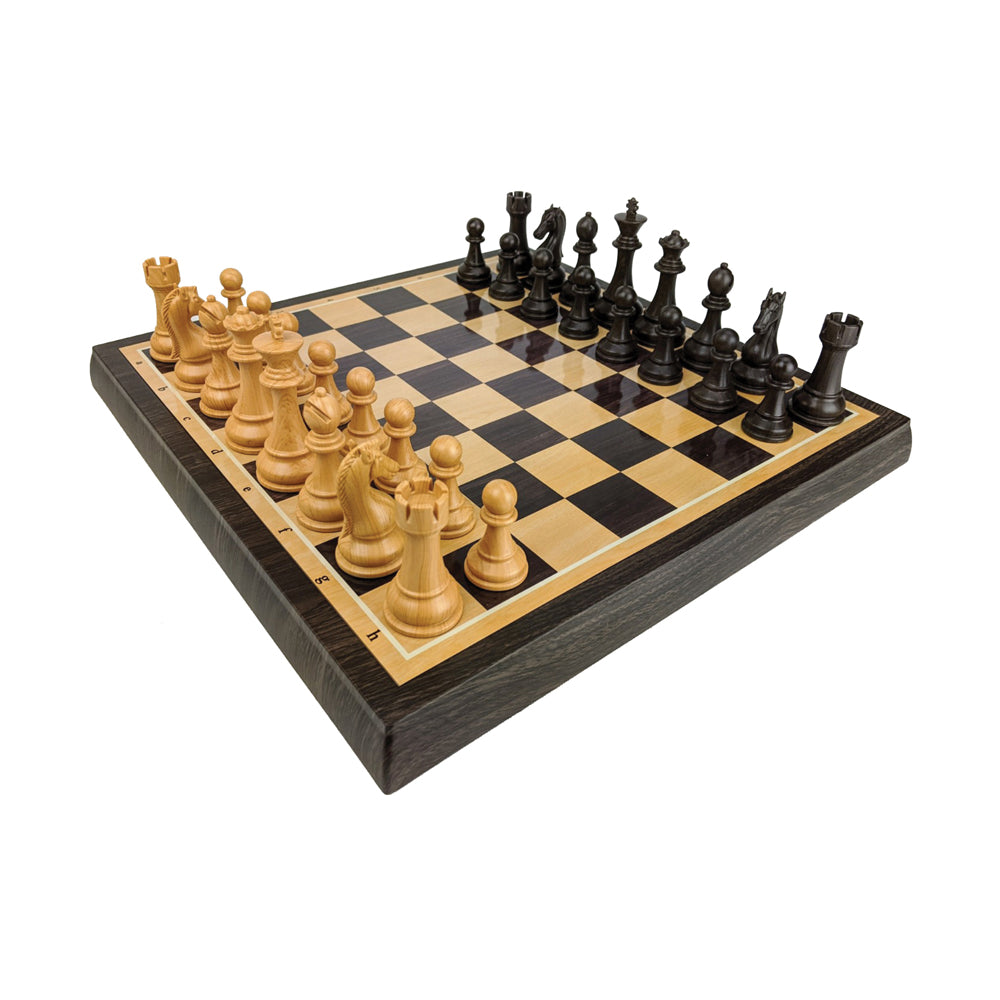 Classic wooden chess set with natural light wood and black pieces on checkered board with dark wood frame