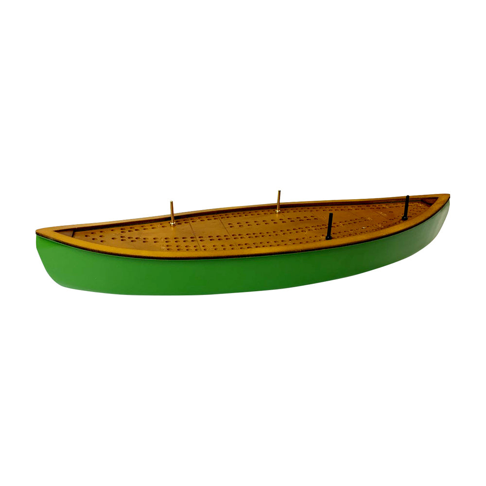 Green and yellow wooden canoe-shaped cribbage board with perforated playing surface and metal pegs