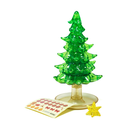 Green translucent 3D crystal Christmas tree puzzle with gold base, assembled with instruction sheet and yellow star ornament