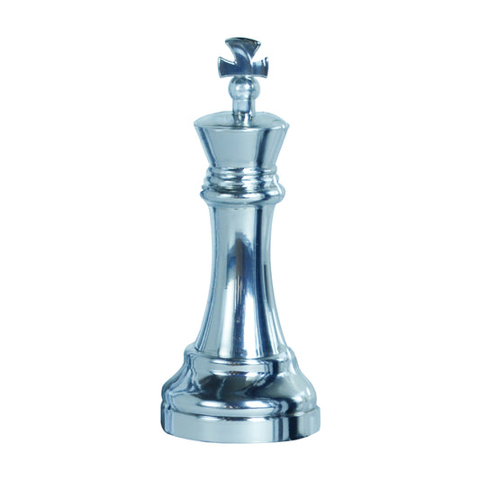 Silver metallic chess king piece puzzle on plain white background