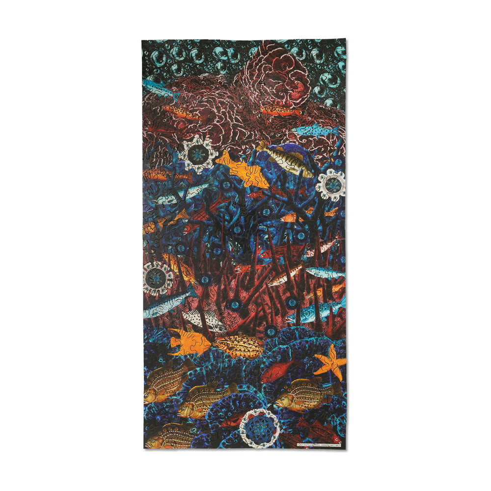 AreYouGame Oceanic Fish wooden jigsaw puzzle showing intricate underwater scene with colorful fish, coral, and decorative patterns in blue, orange, red, and tea