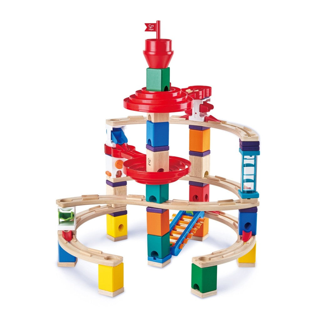 Hape Quadrilla Super Spiral wooden marble run with colorful stacked blocks, curved wooden tracks, and red spiral chutes on plain white background