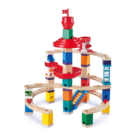 Hape Quadrilla Super Spiral wooden marble run with colorful stacked blocks, curved wooden tracks, and red spiral chutes on plain white background
