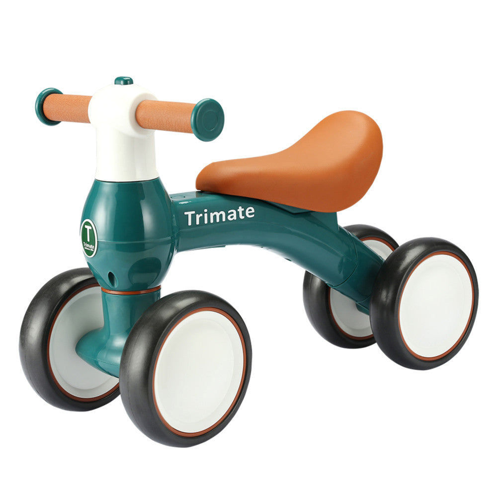 Teal and white ride-on balance bike with brown leather saddle, cork handles, and black wheels with white center hubs