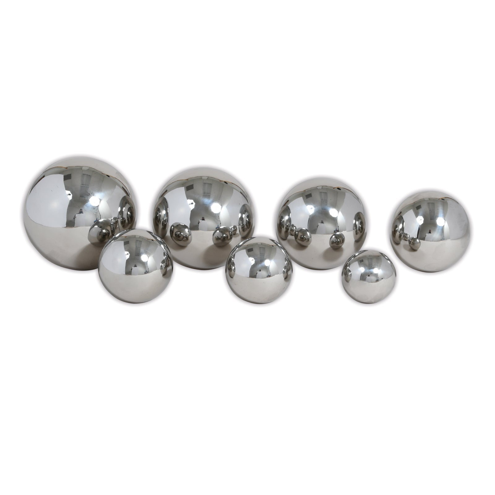 Set of 7 reflective silver metal balls in varying sizes arranged on a white background