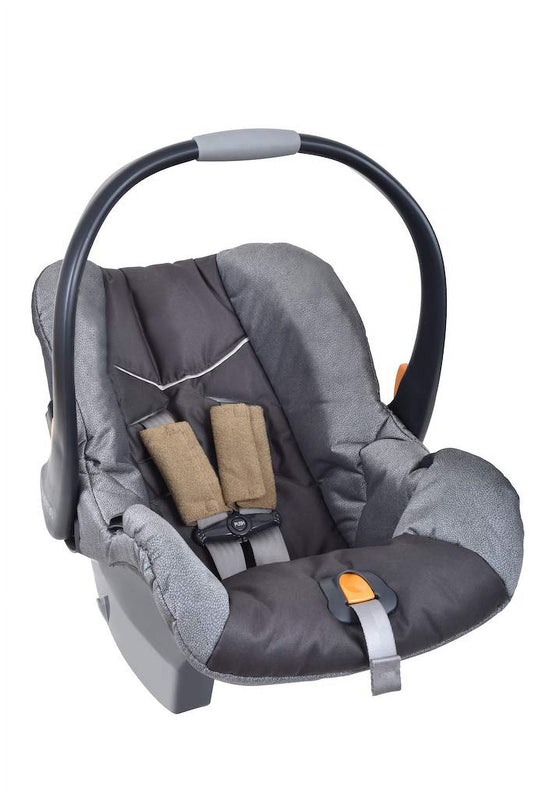 Infant car seat with gray and black fabric, padded shoulder harness straps with tan plush covers, and orange safety buckle detail