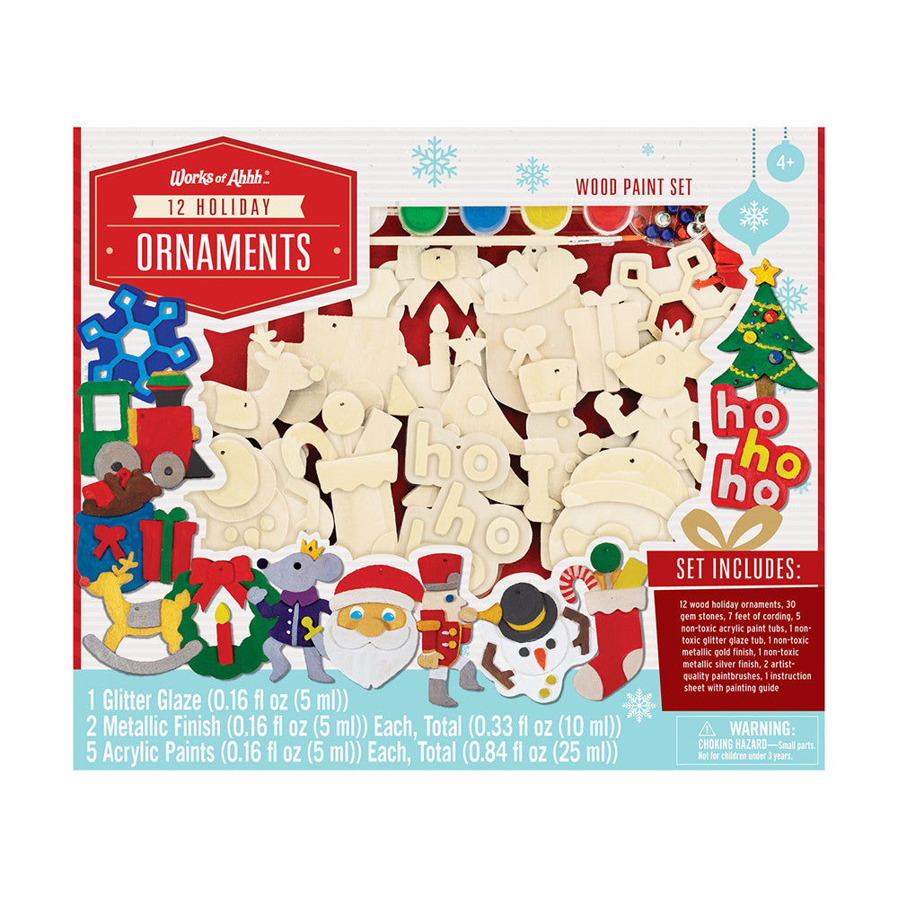 Works of Ahhh 12 Holiday Ornaments Wood Paint Set with cream-colored wooden shapes, paint tubes, and decorative holiday designs on packaging
