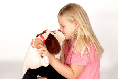 Beige plush puppy with brown spots and pink collar held and hugged by a child modeled by a child wearing a pink shirt