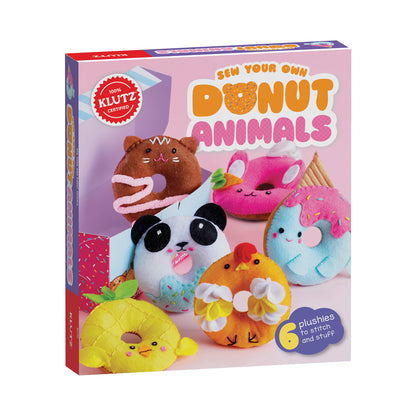 Klutz Sew Your Own Donut Animals craft kit box showing six colorful plush donut-shaped animals with embroidered faces in brown, pink, white, blue, yellow, and o