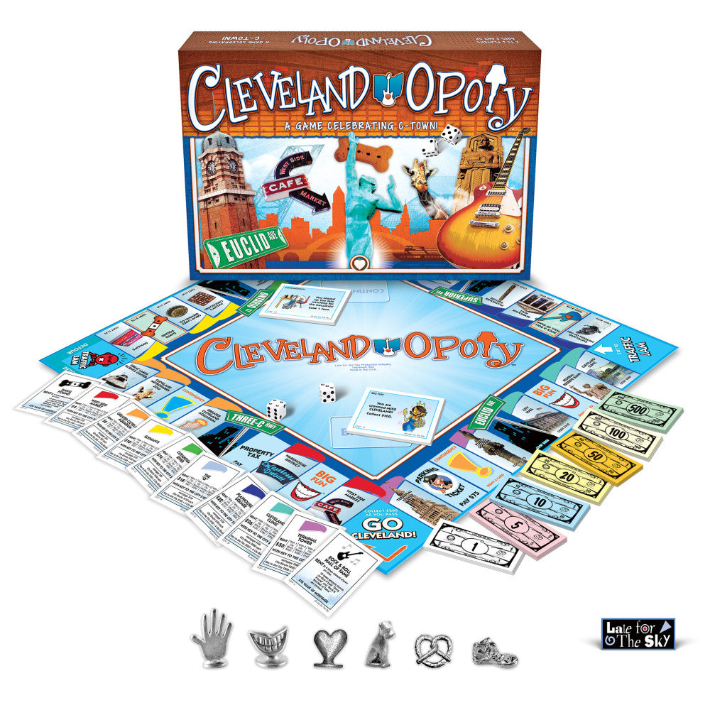 Cleveland-opoly board game box and contents displayed, including game board, property cards, play money in various denominations, instruction sheets, dice, and