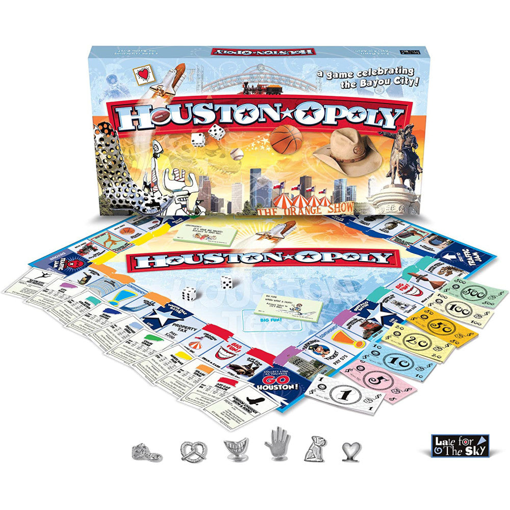 Houston-Opoly board game box and contents laid out, including game board, colorful play money, dice, player tokens, and instruction cards featuring Houston land