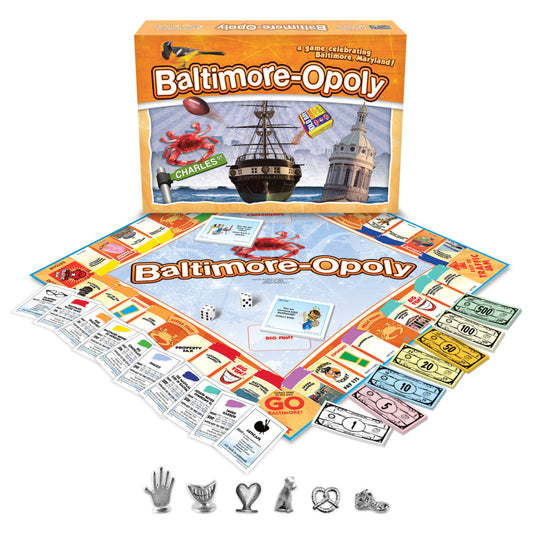 Baltimore-opoly board game box and components displayed, including game board, property cards, dice, play tokens, and colored money bills featuring Baltimore la