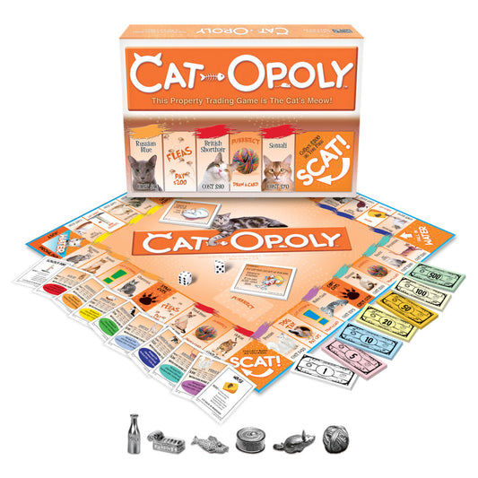 Cat-Opoly board game box and contents displayed, including game board, property cards featuring cat breeds, colorful play money, dice, and metal cat-shaped game