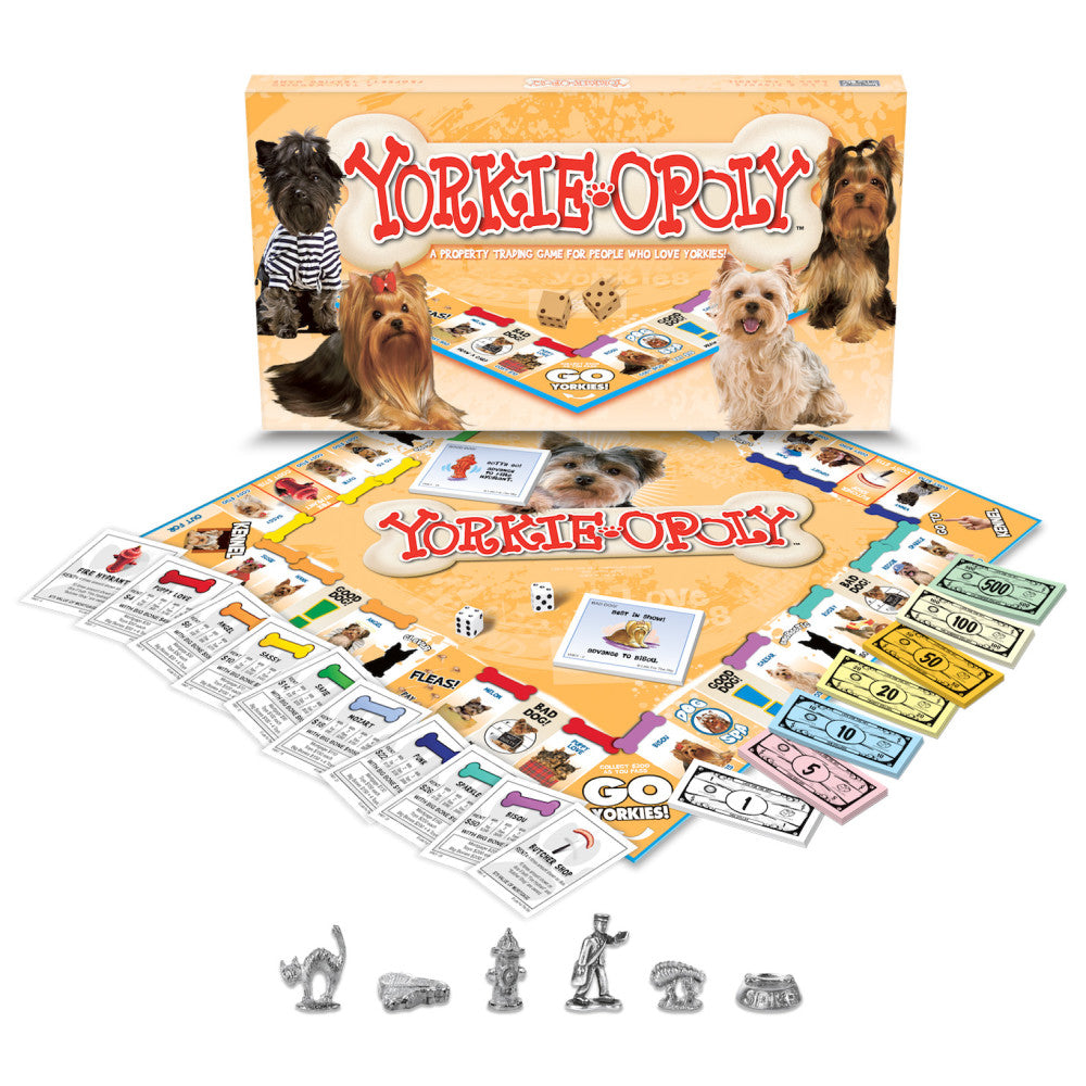 Yorkie-Opoly board game box and contents displayed, including game board, player tokens shaped like Yorkshire Terriers, property cards, dice, and colorful play
