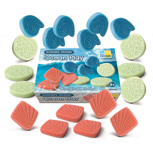 Scenery Stones Ocean Play set with 18 textured stones: blue spiral shells, green circular stones with swirl patterns, and red shell-shaped pieces arranged aroun