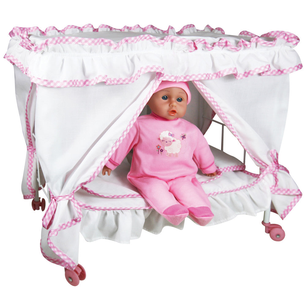 Baby doll in pink outfit seated inside white canopy bed with pink gingham trim and wheels