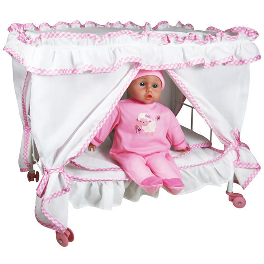Baby doll in pink outfit seated inside white canopy bed with pink gingham trim and wheels