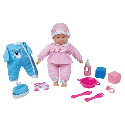 Baby doll in pink outfit with floral hat, surrounded by accessories including blue outfit, bottle, bowl, utensils, and blocks