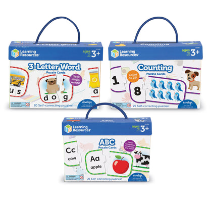 Three Learning Resources puzzle card sets with blue carrying handles: 3-Letter Word Puzzle Cards (20 puzzles), Counting Puzzle Cards counting to 25 (25 puzzles)